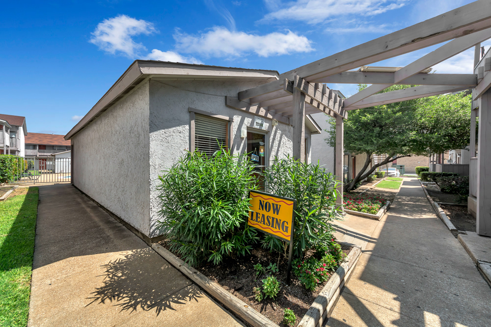the front entrance to a home with a sign for sale at The Arlington Park Apartments